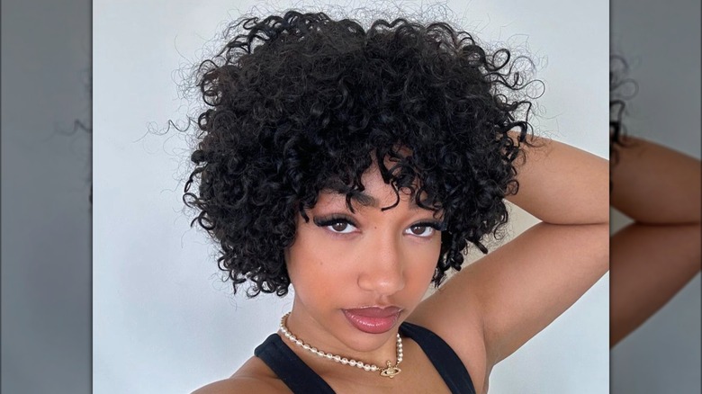 woman with curly bob haircut