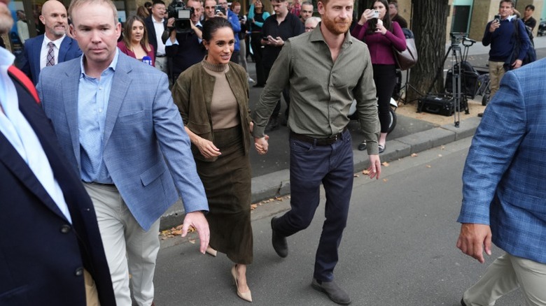 Crowds gather around Meghan Markle and Prince Harry in Melbourne