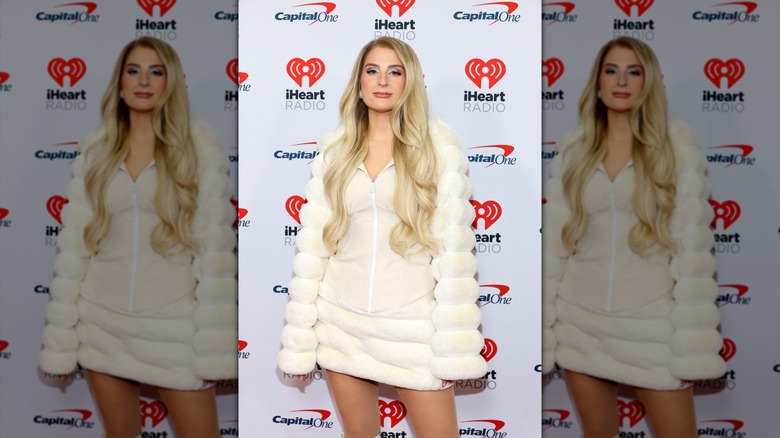 Meghan Trainor posing in white at the iHeartRadio Jingle Ball