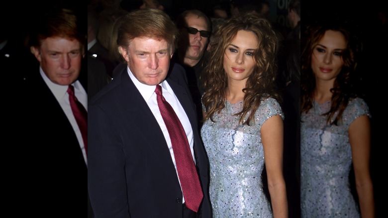 Melania Trump in 2000 with curly brown hair, posing with Donald Trump