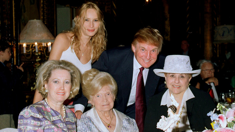 Melania Trump posing with Donald Trump and his mother and sister at Mar-a-Lago in 2000