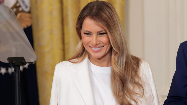 Melania Trump smiles for a crowd