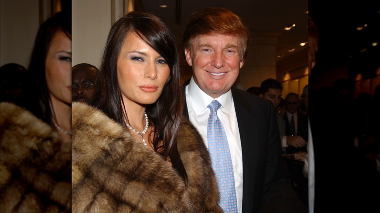 Melania Trump with a deep side part and Donald Trump