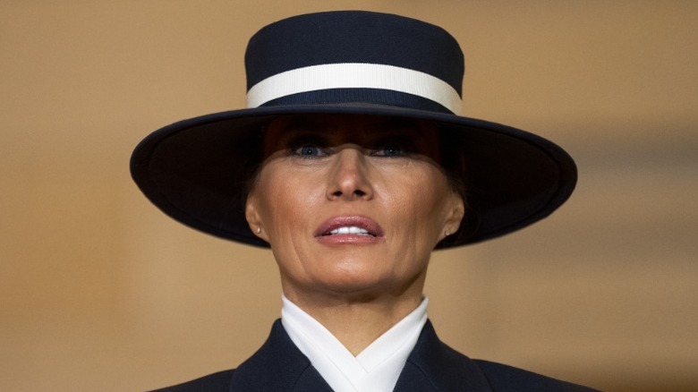 Melania Trump wearing a navy-and-white hat at the 2025 presidential inauguration