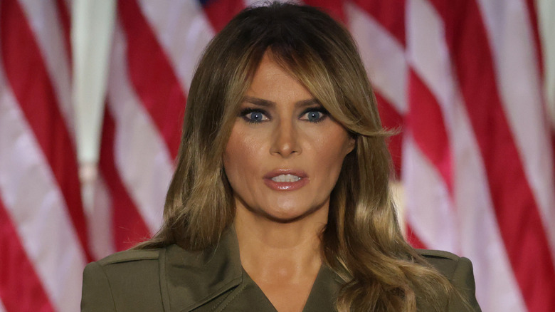 Melania Trump in a green jacket