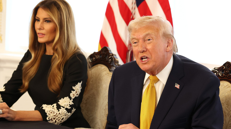 Donald Trump and first lady Melania Trump speaking to service members on Christmas Eve