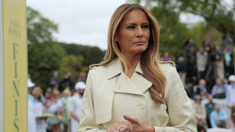 Melania Trump stands outside in the White House Rose Garden