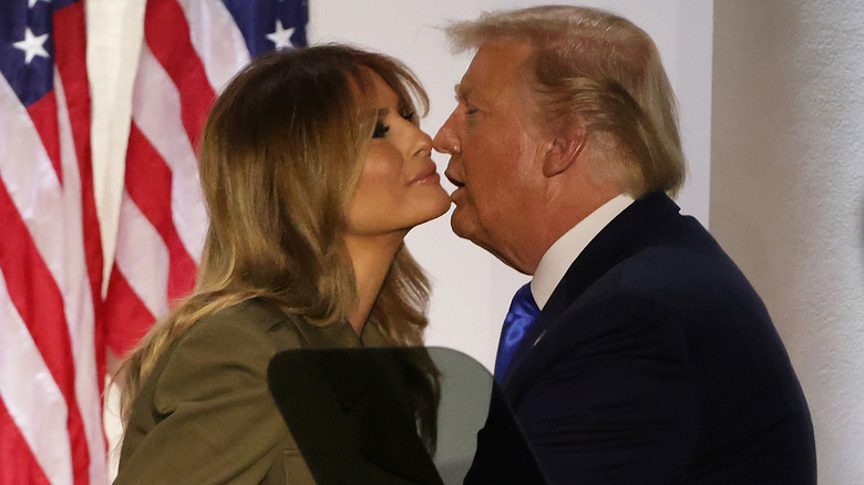 Donald and Melania Trump sharing a kiss
