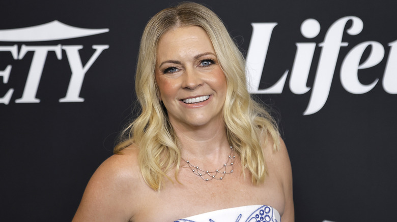 Melissa Joan Hart smiling on the red carpet in 2025
