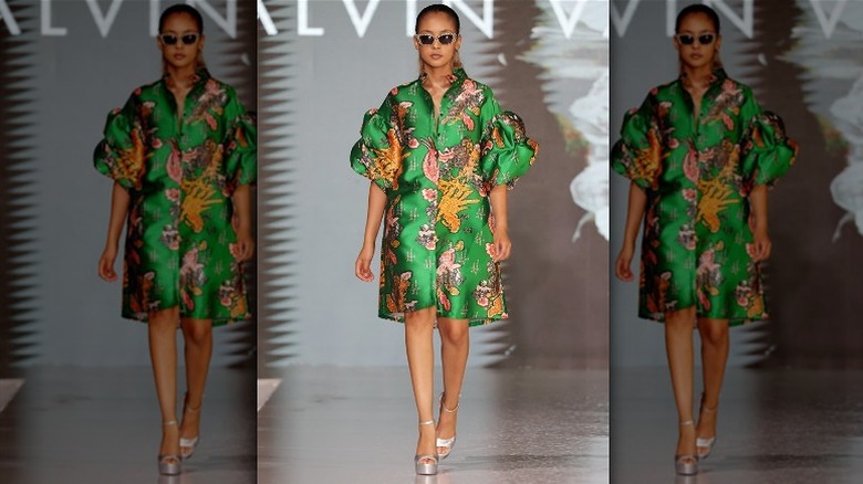 model with green cover-up