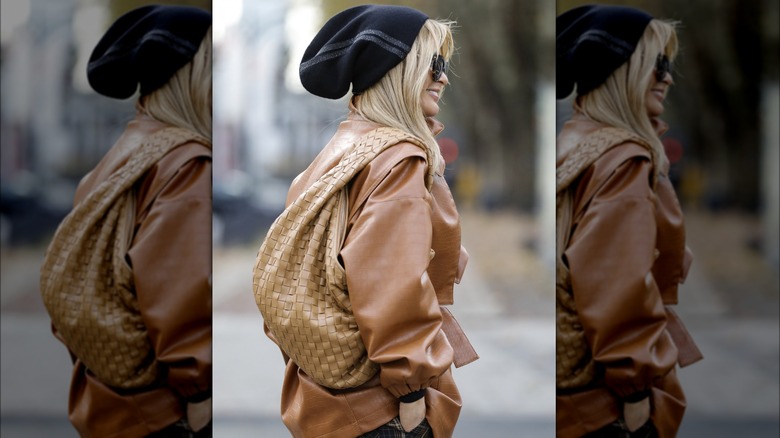 Woman carrying oversized slouchy bag