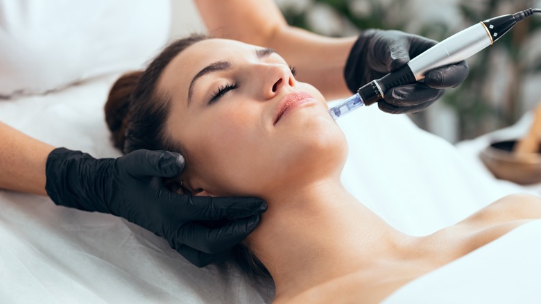 woman getting microneedling done