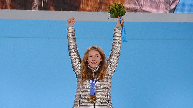 Mikaela Shiffrin stands on the podium accepting gold for her alpine skiing