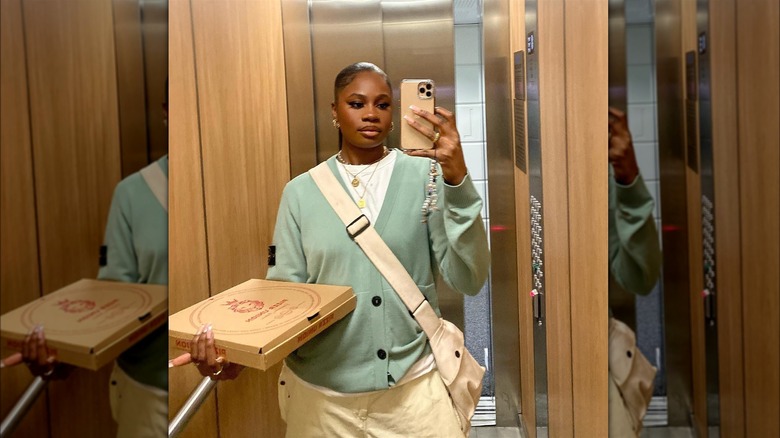 Girl wearing a mint knit cardigan