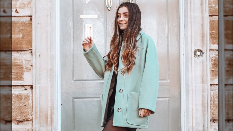 Girl wearing a mint green coat