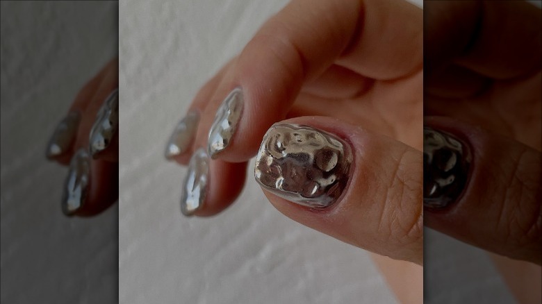 hand with mirrored nails