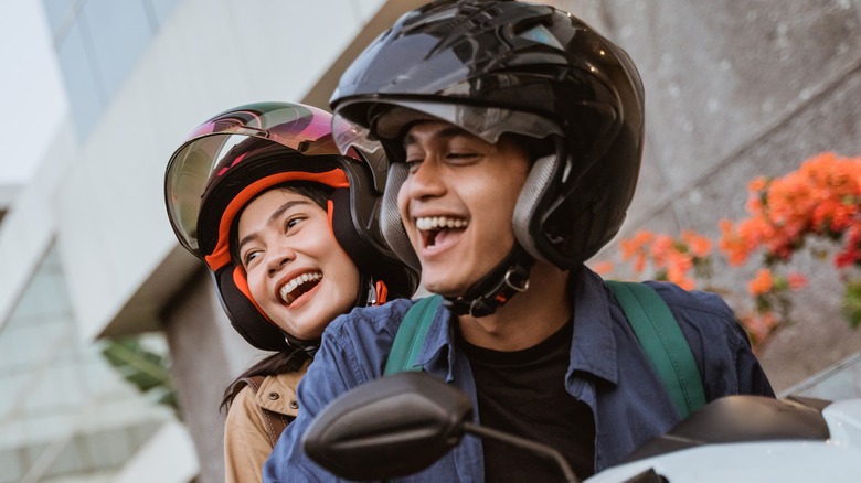 two people on scooter