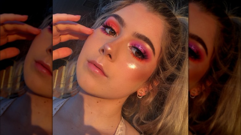 woman wearing mismatched eyeshadow