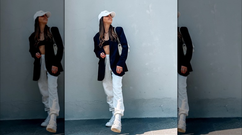 Girl wearing sweats and a blazer.