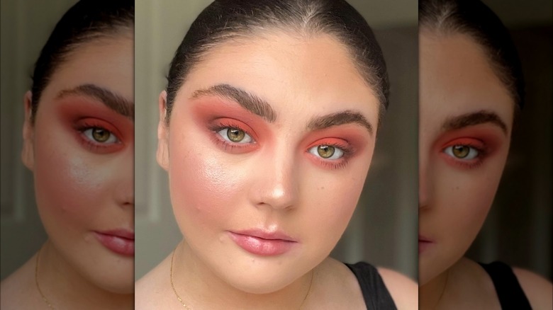 Girl wearing orange eyeshadow.