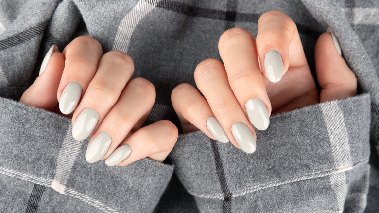 Pale gray nails on a plaid background