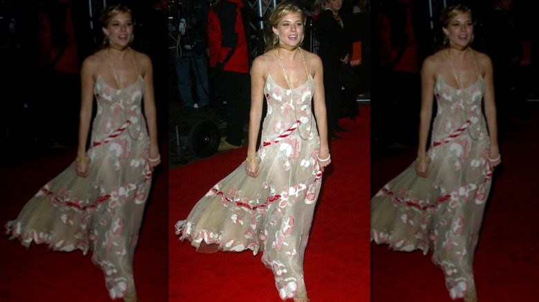 Sienna Miller walks down the red carpet at the 2005 BAFTAs