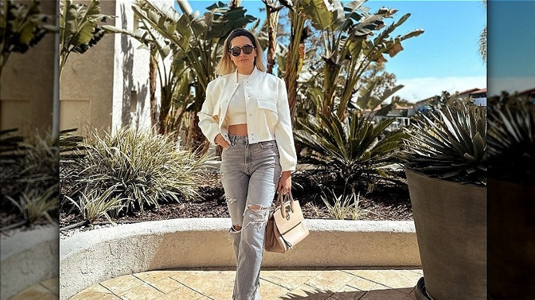 Person carrying a Ferragamo bag