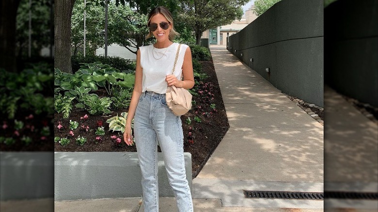 Woman poses in muscle tank