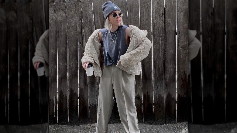 Woman poses in muscle tank