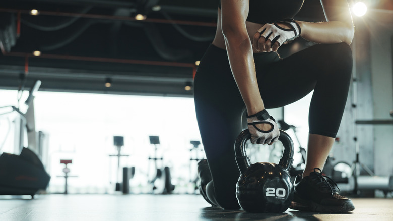 woman squatting with barbell