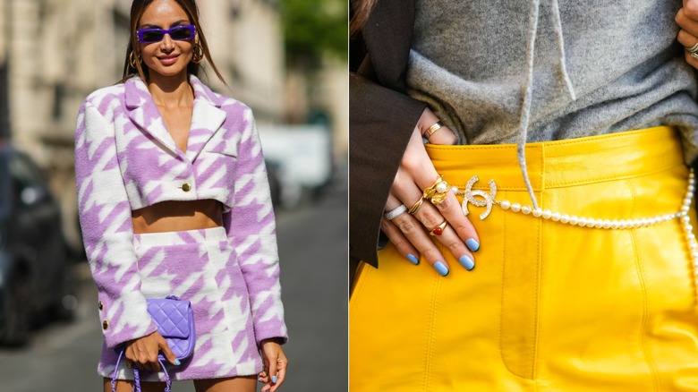 Two women wearing light blue nail polish with patterned and bold outfits
