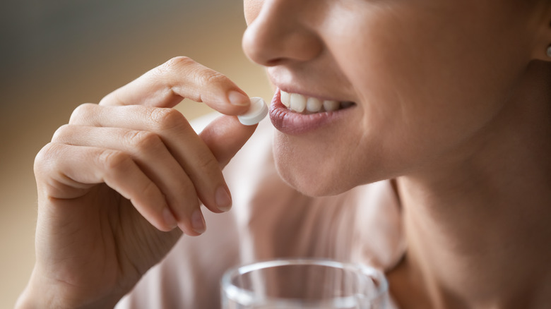 woman taking supplements