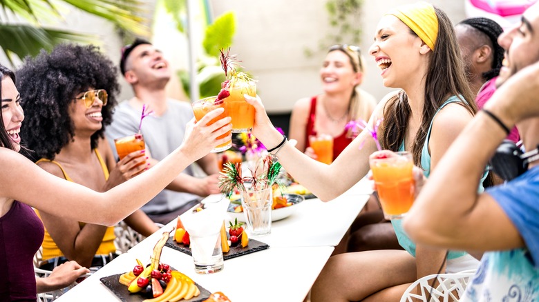 Friends drinking cocktails together