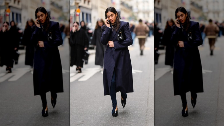 woman wearing a navy blue trench