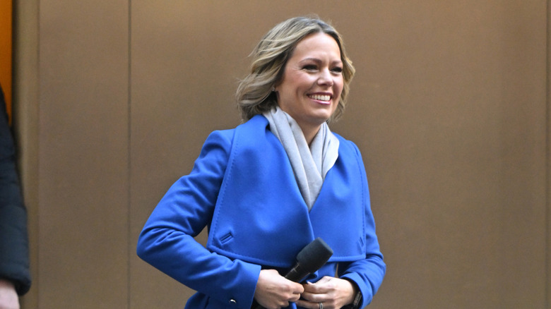 Dylan Dreyer buttons up her coat as she walks outside The Today Show studio