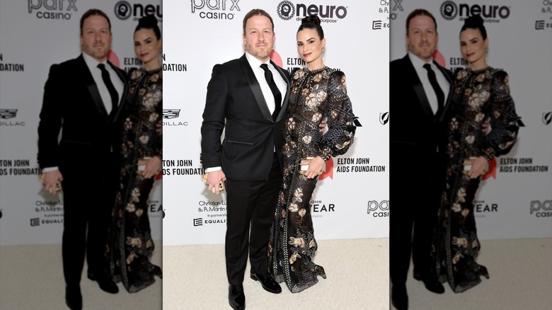 Katrina Law smiles with Keith Andreen on the red carpet