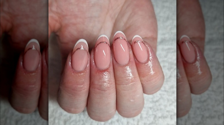 negative space French manicure in white and glitter