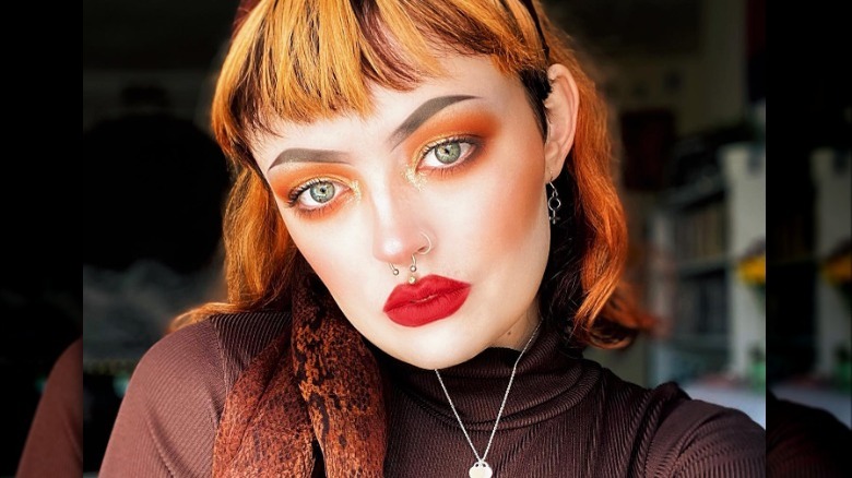 Bright neon orange smoky eye