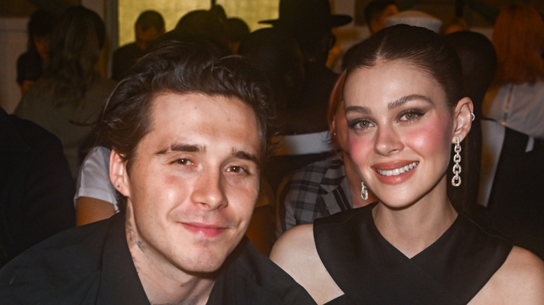 Brooklyn Beckham and Nicola Peltz wearing black