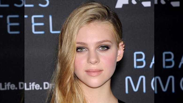 Nicola Peltz with blond hair