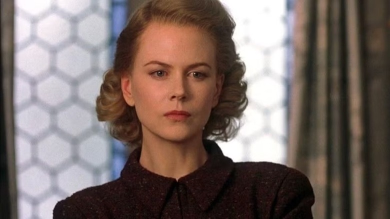 Nicole Kidman acting in "The Others" with a red-blond '40s style wig