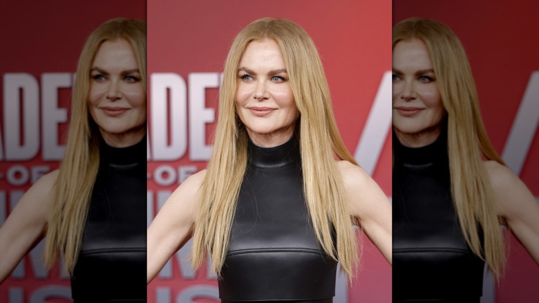 Nicole Kidman posing in a long wig at the Country Music Awards