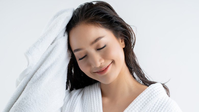 woman drying her hair
