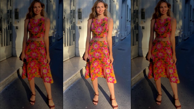 Woman wearing floral top, skirt