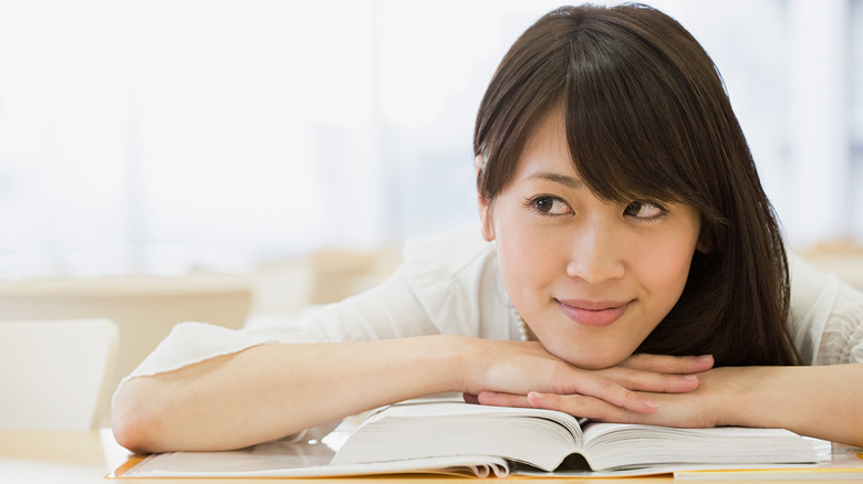 woman happily deep in thought