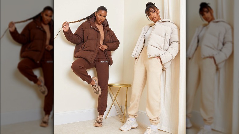 two woman wearing puffer hoodies