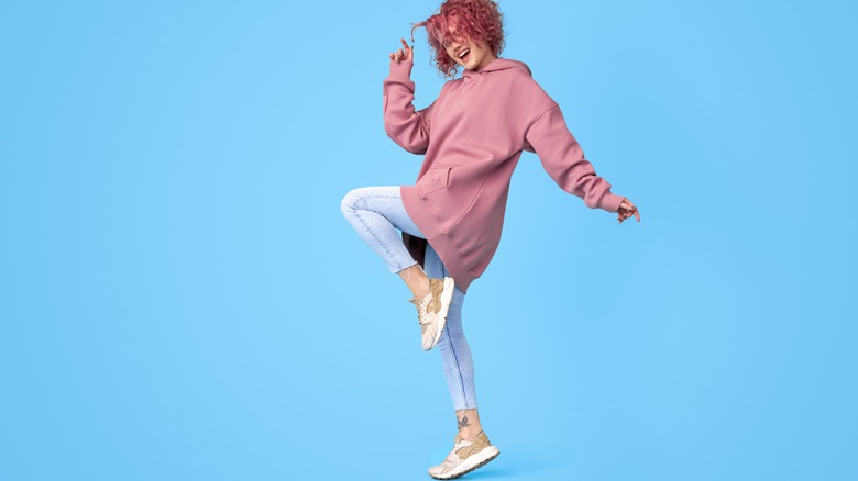 woman wearing a pink hoodie