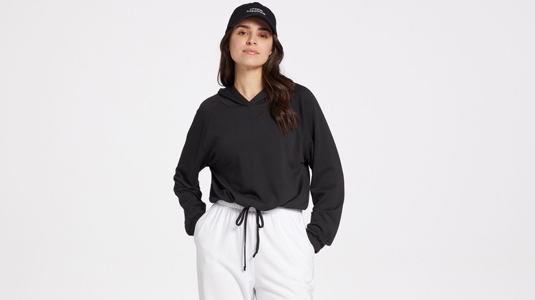 woman in cropped black hoodie