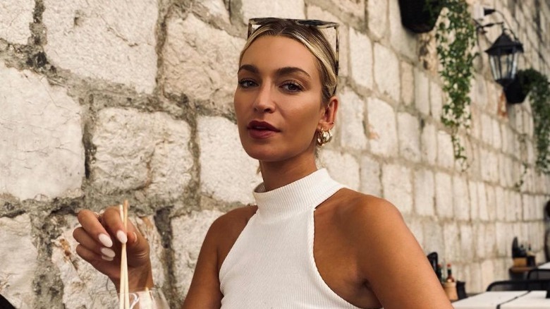 Woman wears low slicked-back bun