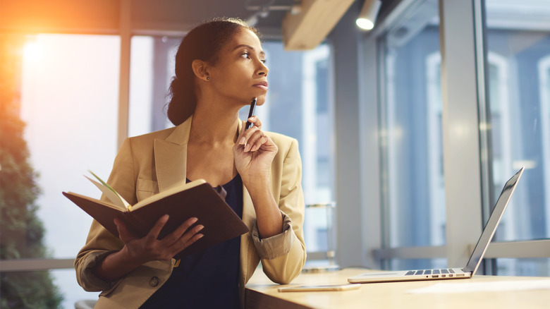young woman thinking in her office